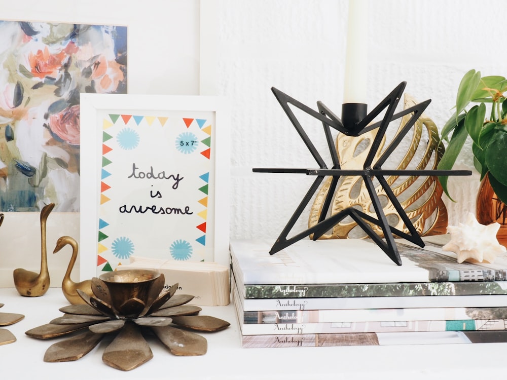 brown candle holder on table near books