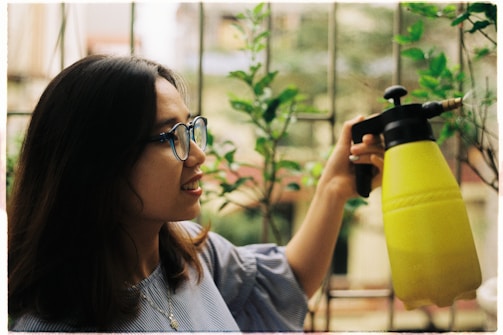 woman holding water sprayer