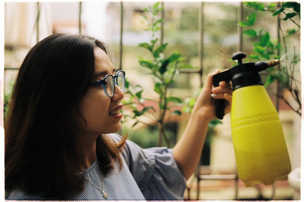 woman holding water sprayer