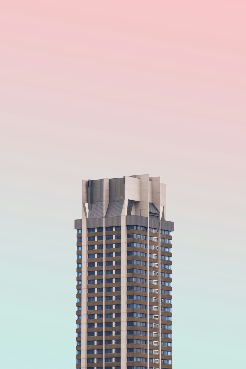 white and black high-rise building with glasses