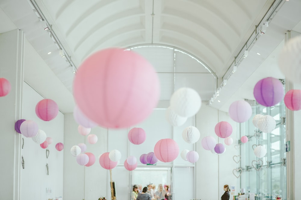 photo of pink, white and purple paper lanterns