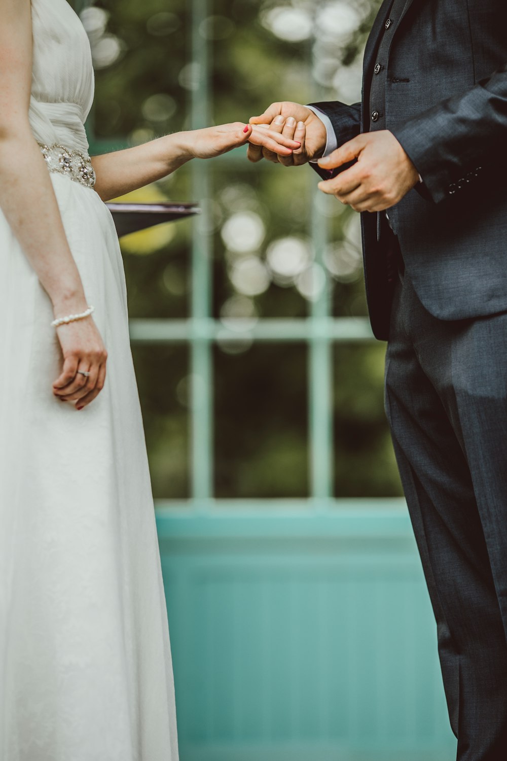 wedding couple holding hands together