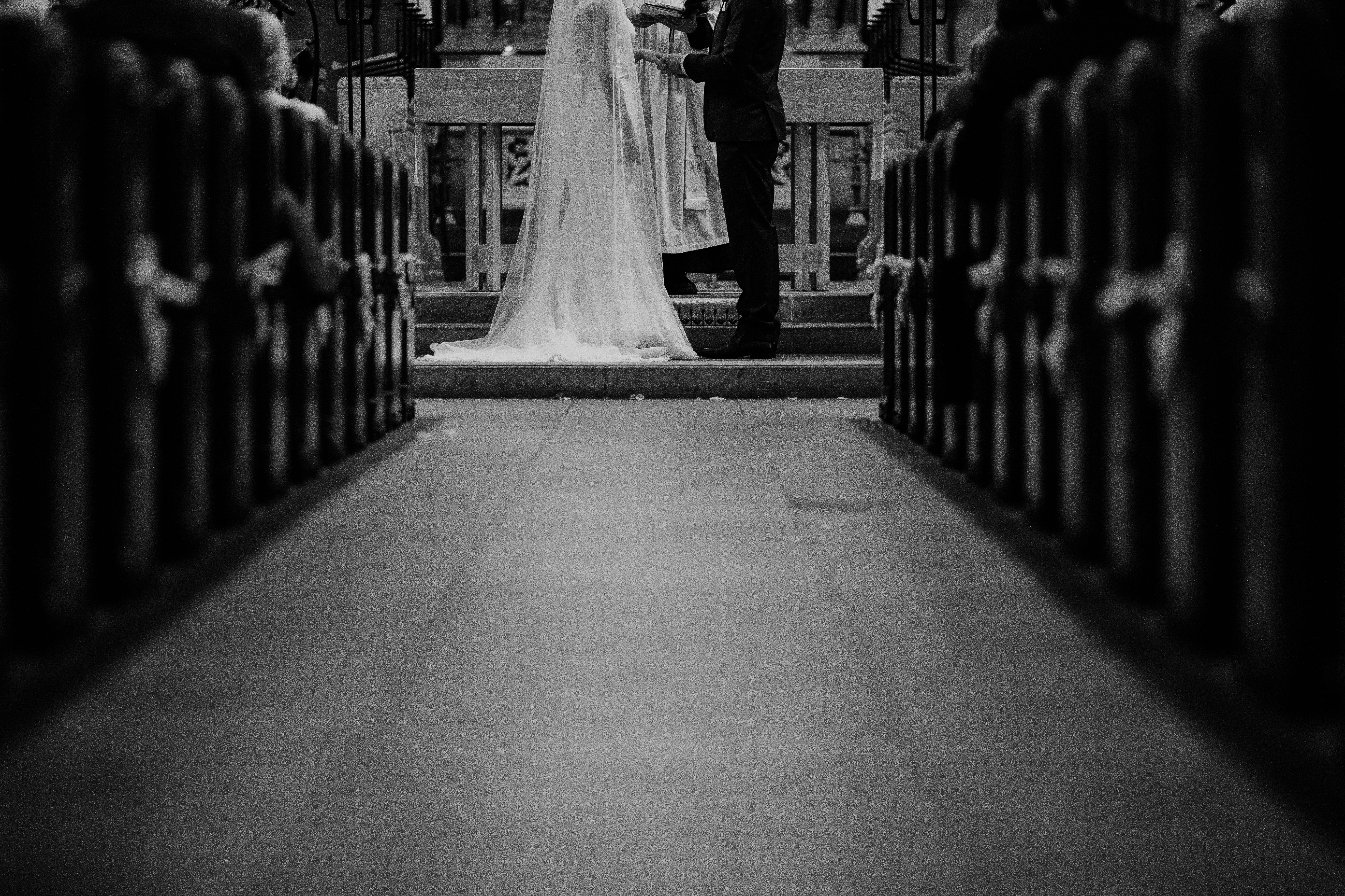 grayscale photo of groom and bride
