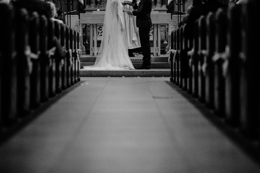 grayscale photo of groom and bride