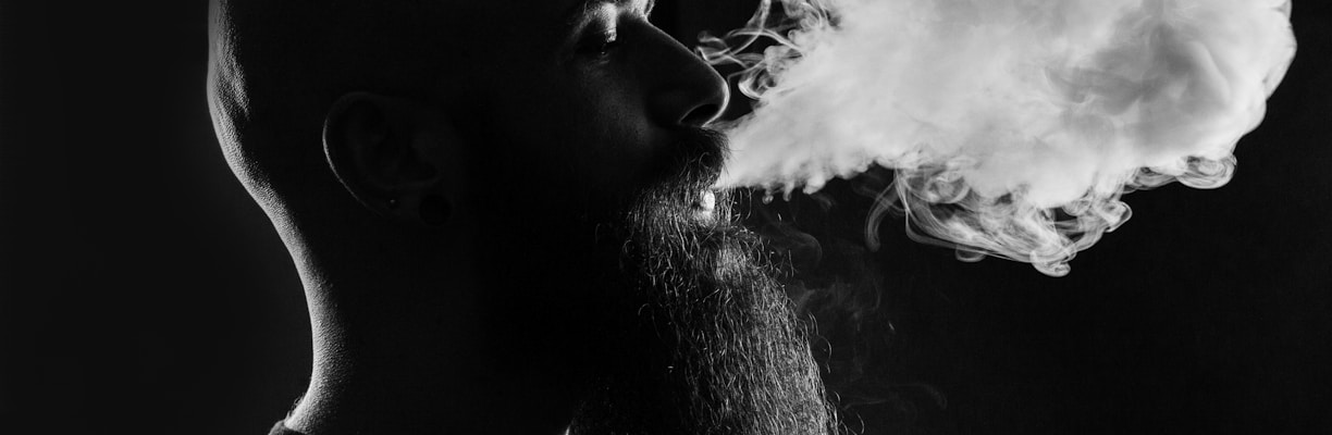 man smoking with black background