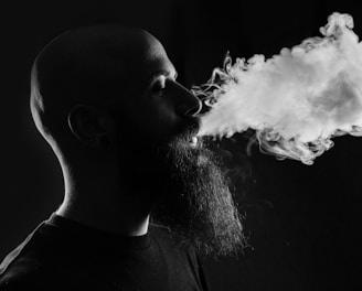 man smoking with black background