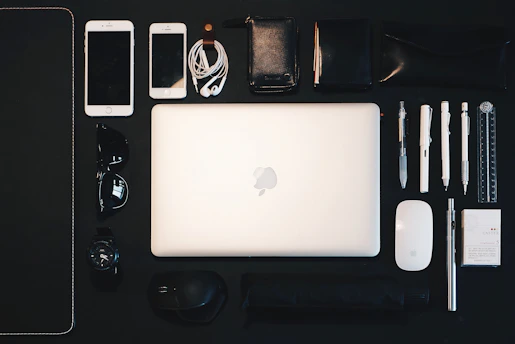 A collage showing a laptop, bike, and textbooks arranged neatly on a desk.