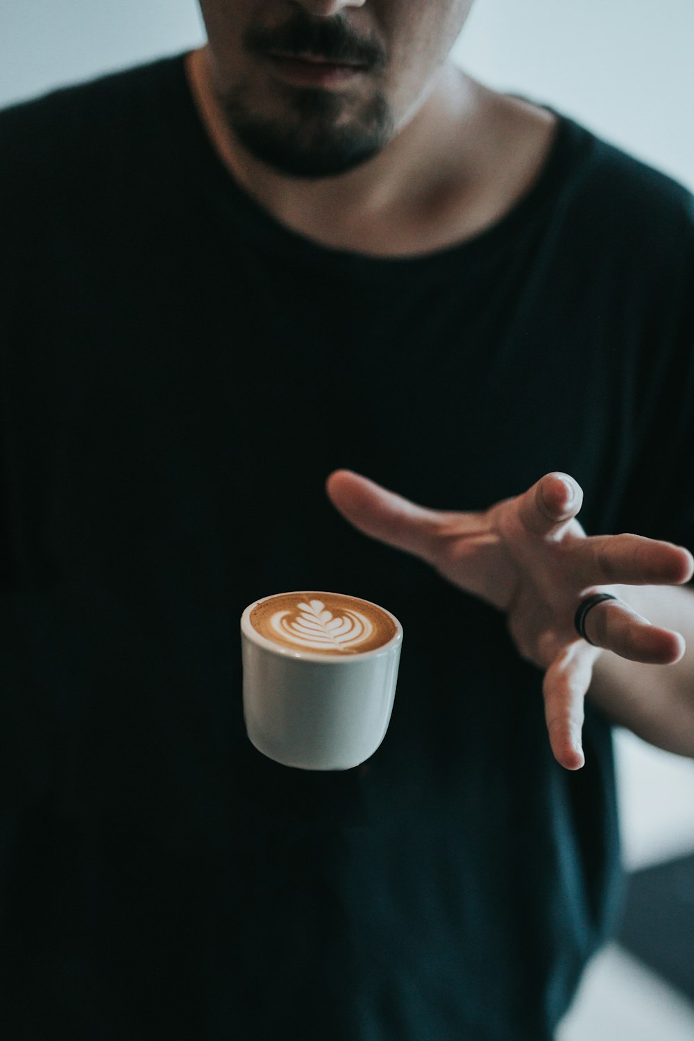 person catching white mug