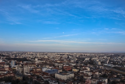 Aerial view captured by a drone showing a sprawling urban landscape.