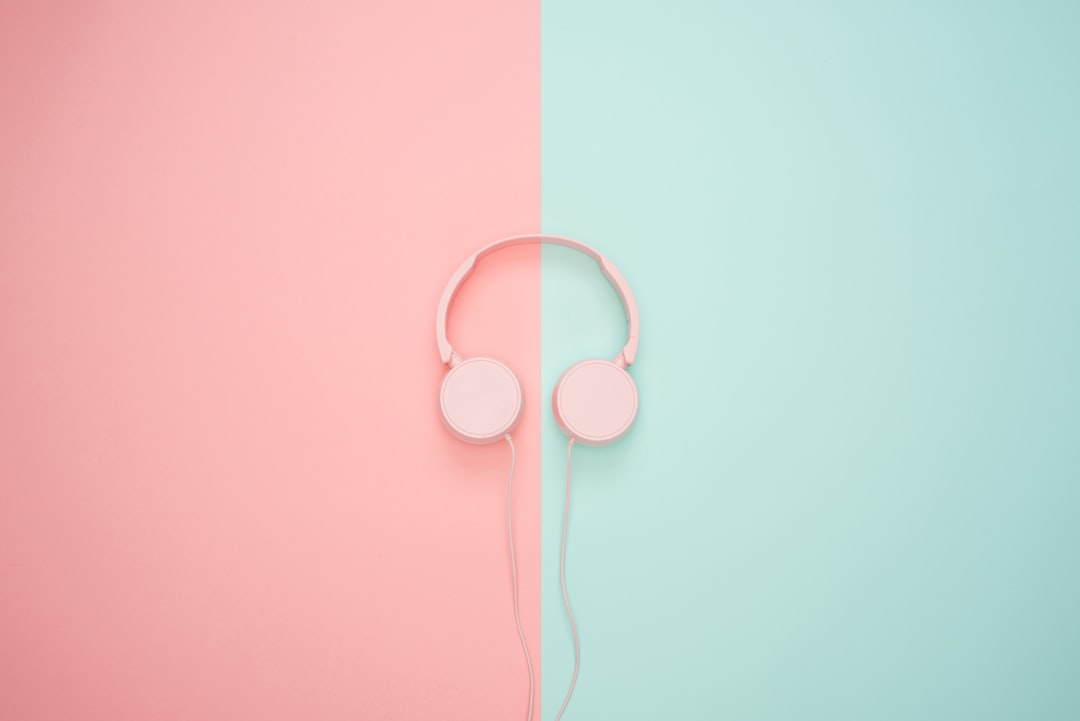 white corded headphones, Pink headphones on a pastel background