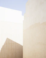 a man riding a skateboard down a street next to tall buildings