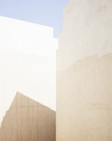 a man riding a skateboard down a street next to tall buildings