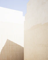a man riding a skateboard down a street next to tall buildings