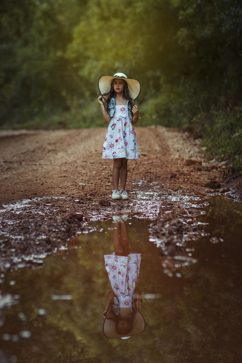 girl standing in front body of water