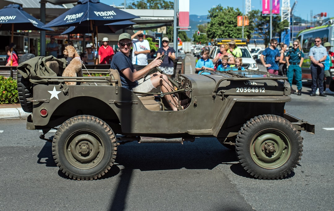 man driving a military jeep