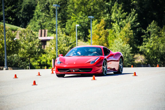 A professional testing a car on a scenic road, capturing the essence of automotive expertise.