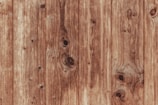 Close-up of plywood texture showing natural wood grain patterns.