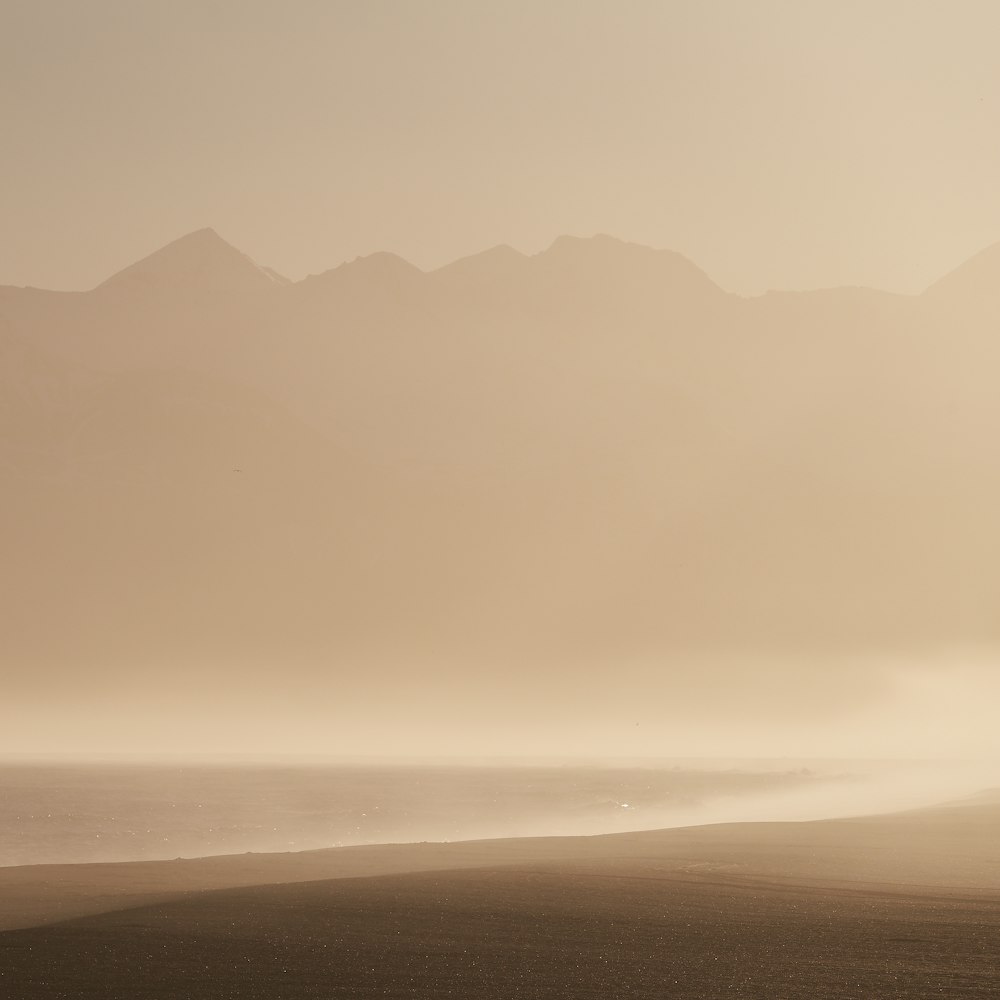 silhouette of foggy mountain range