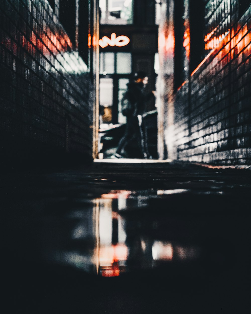 a person standing in a doorway of a building