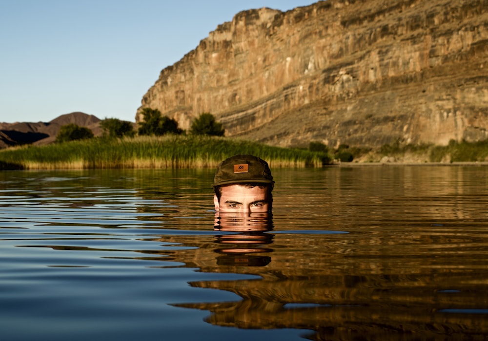 man in body of water facing on camera