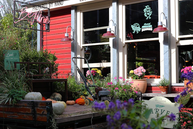 Bright yellow storefront with golden key logo and animated mascot waving cheerfully