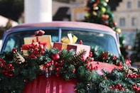 green and red wreath on red car