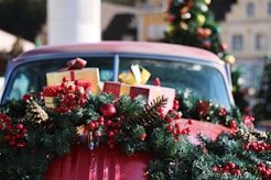 green and red wreath on red car