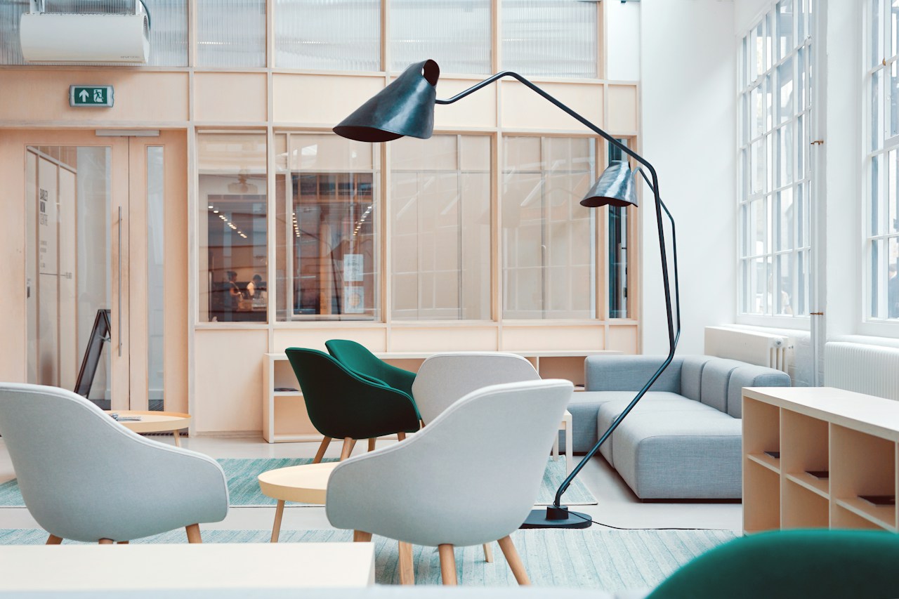 Artisan woodworking atelier featuring hand-carved solid hardwood chair frames in production, traditional joinery techniques, and premium material inventory — high-end furniture sourcing from top global manufacturing hubs for importers and FF&E buyers