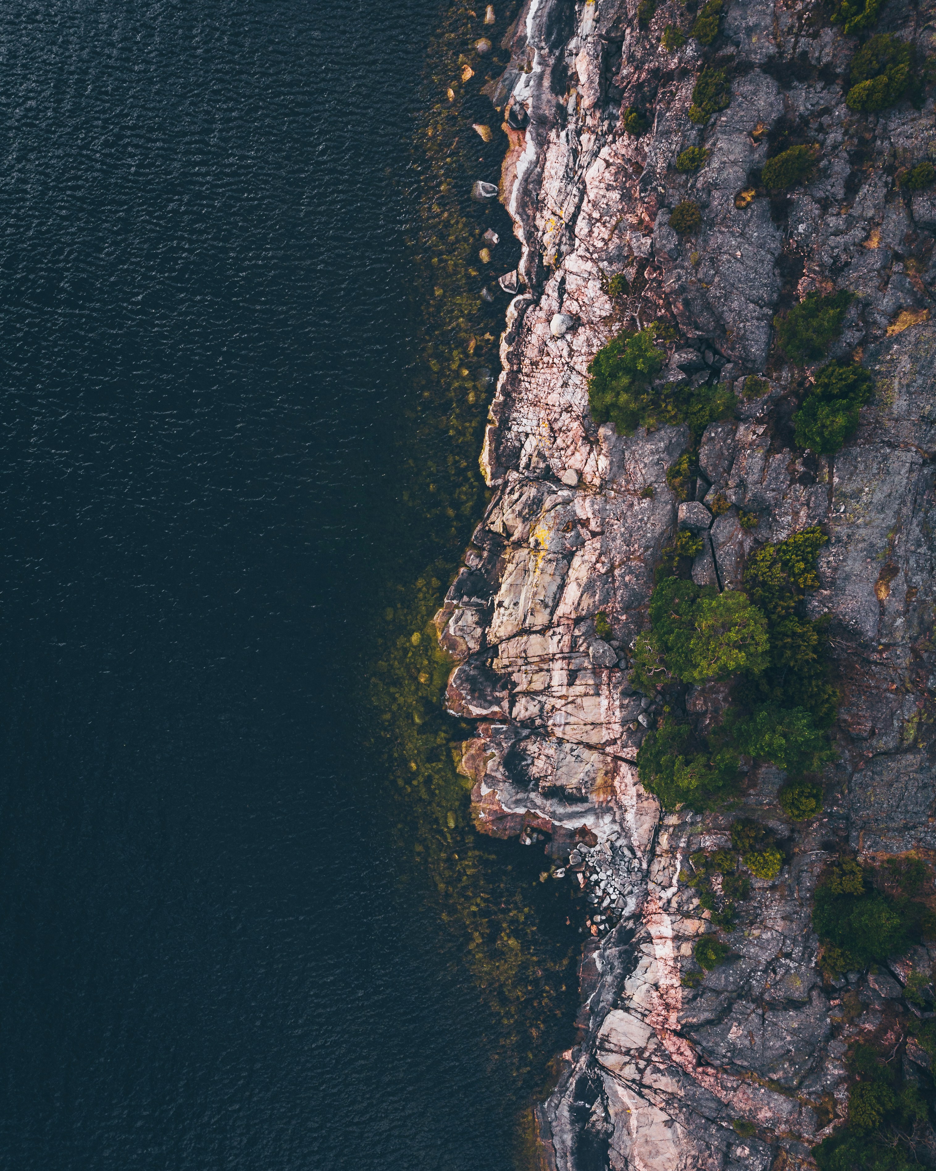 aerial photography of mountain near beach