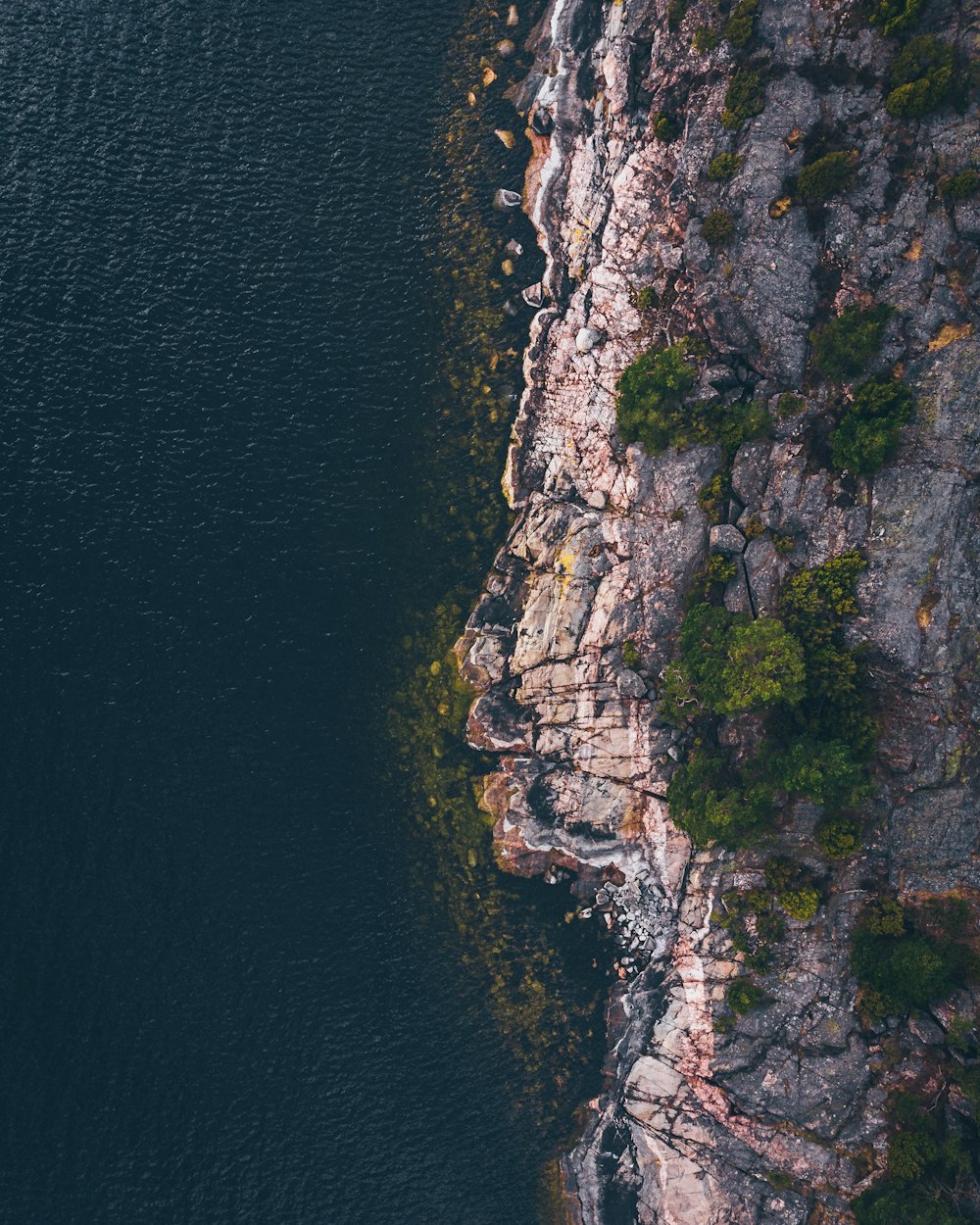 aerial photography of mountain near beach