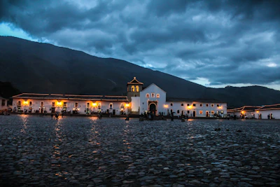 Historic colonial architecture of a charming Sugamuxi town square at sunset.