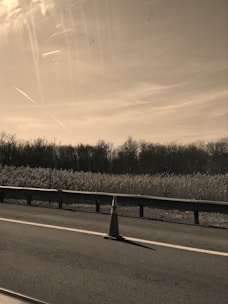 A calm, minimalistic illustration of a construction cone and tools indicating maintenance work.
