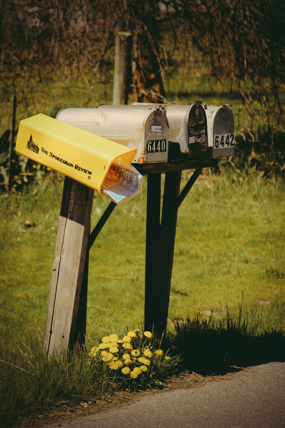 four gray mail boxes