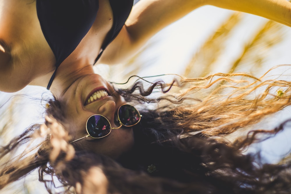 selective focus photography of woman smiling