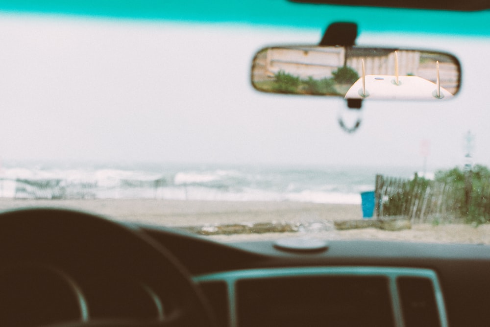 rear view mirror displaying surfboard