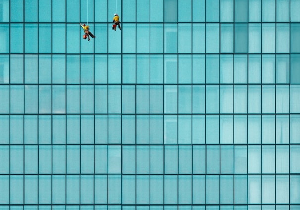 three men cleaning windows