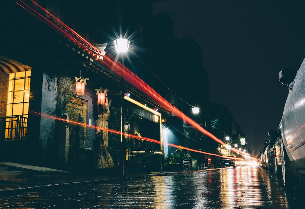 time-lapse photography of cars beside houses