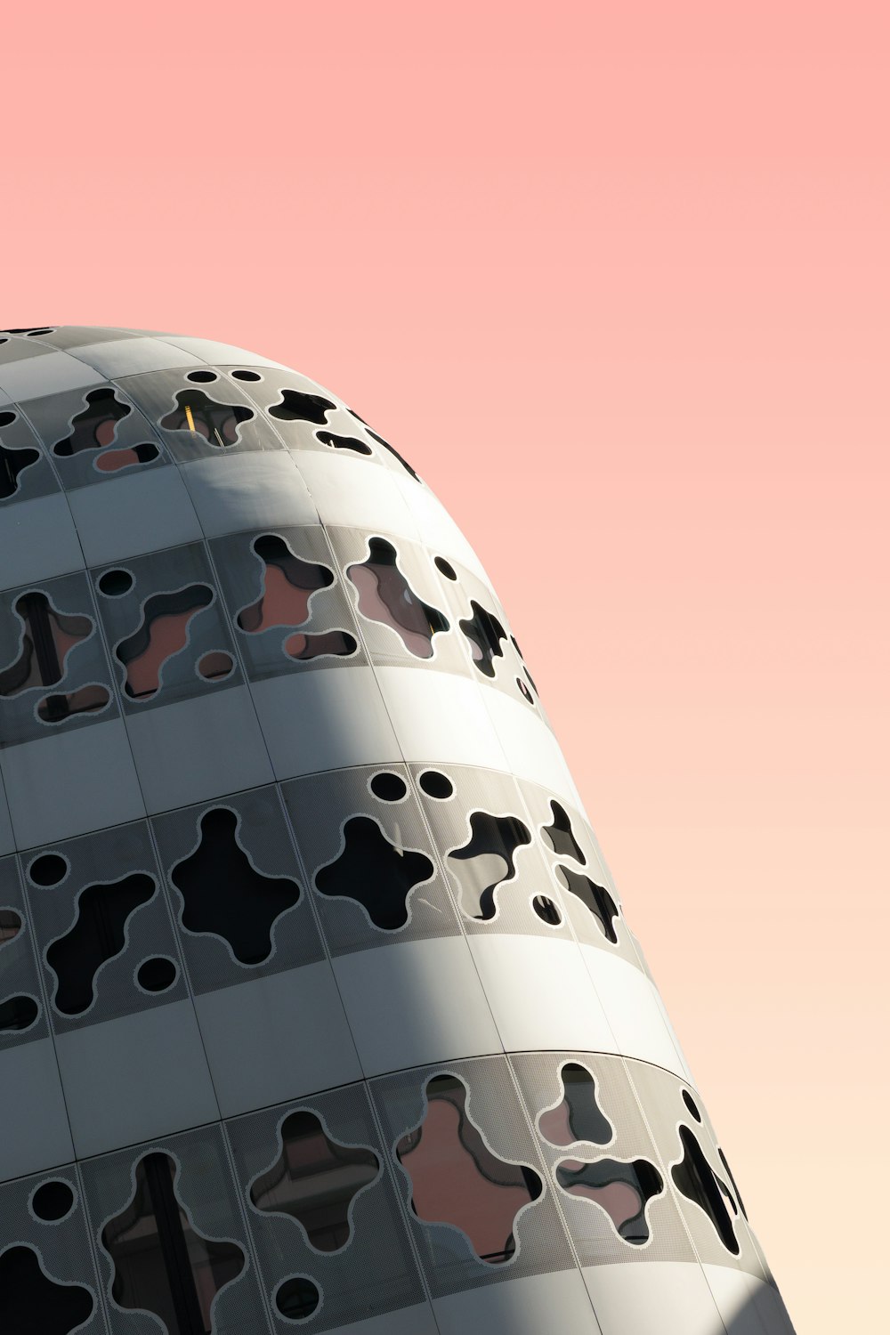 a tall building with a lot of holes in it
