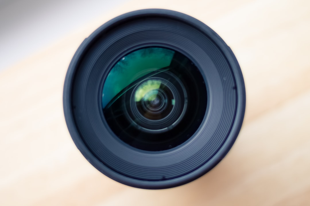 selective focus photography of camera lens