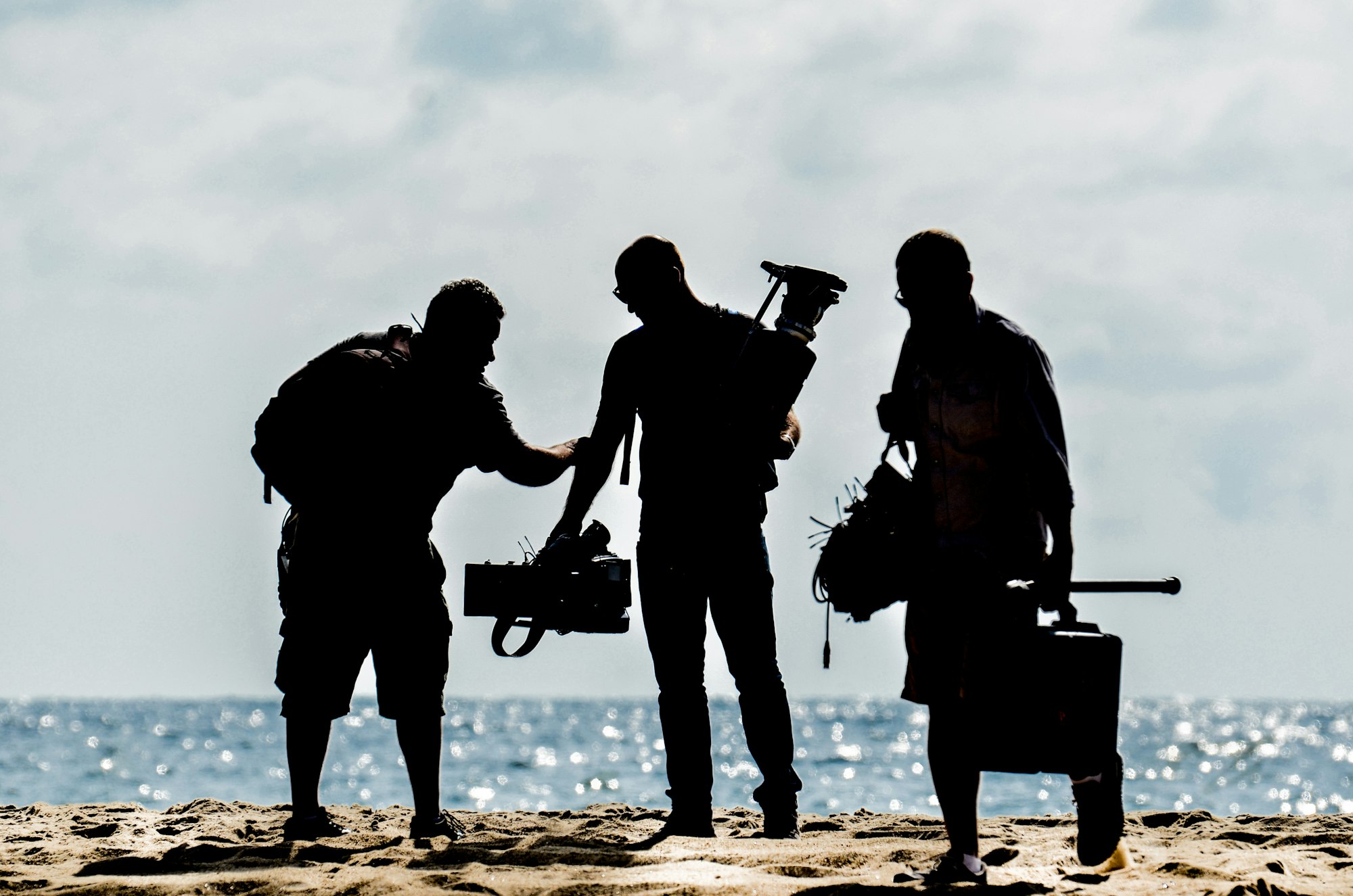 Camera crew of 3 people.  Cameraman, Director and sound mixer.