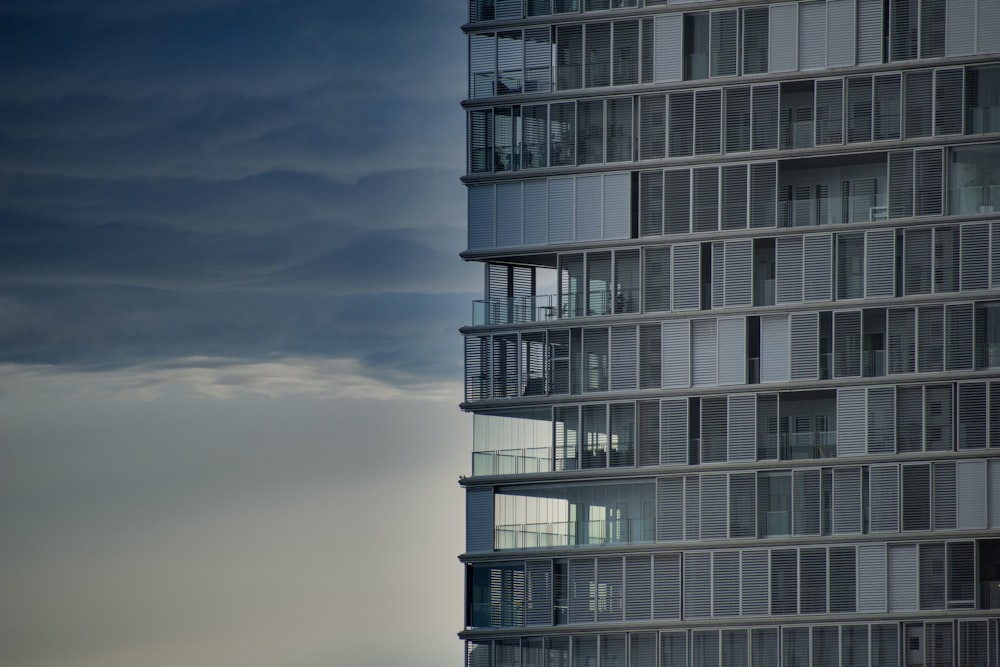 gray concrete building under white clouds