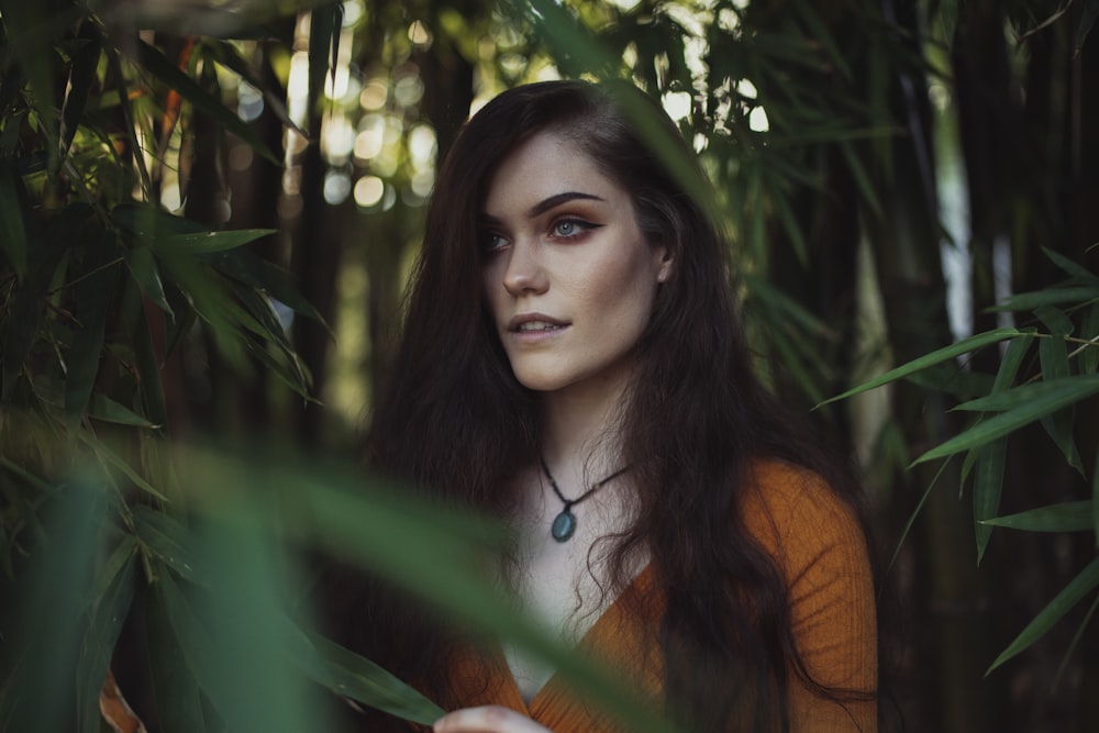 woman surrounded by bamboo grass