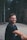 man sits on road