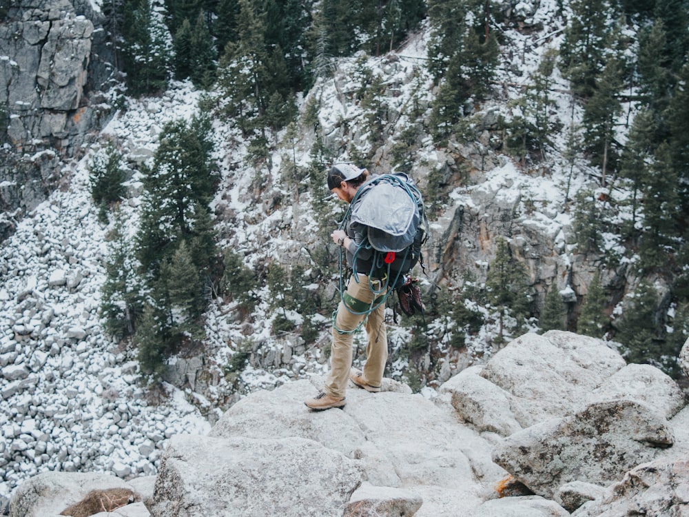 man standing on rock