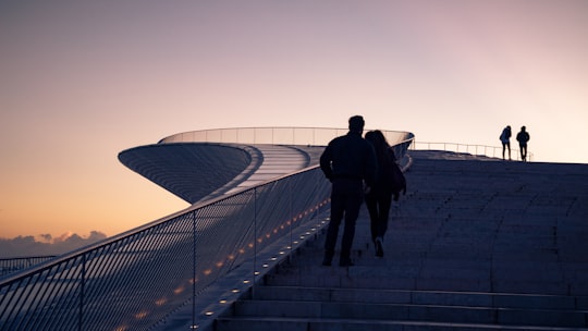 four people climbing stairs during daytime in Belém Portugal