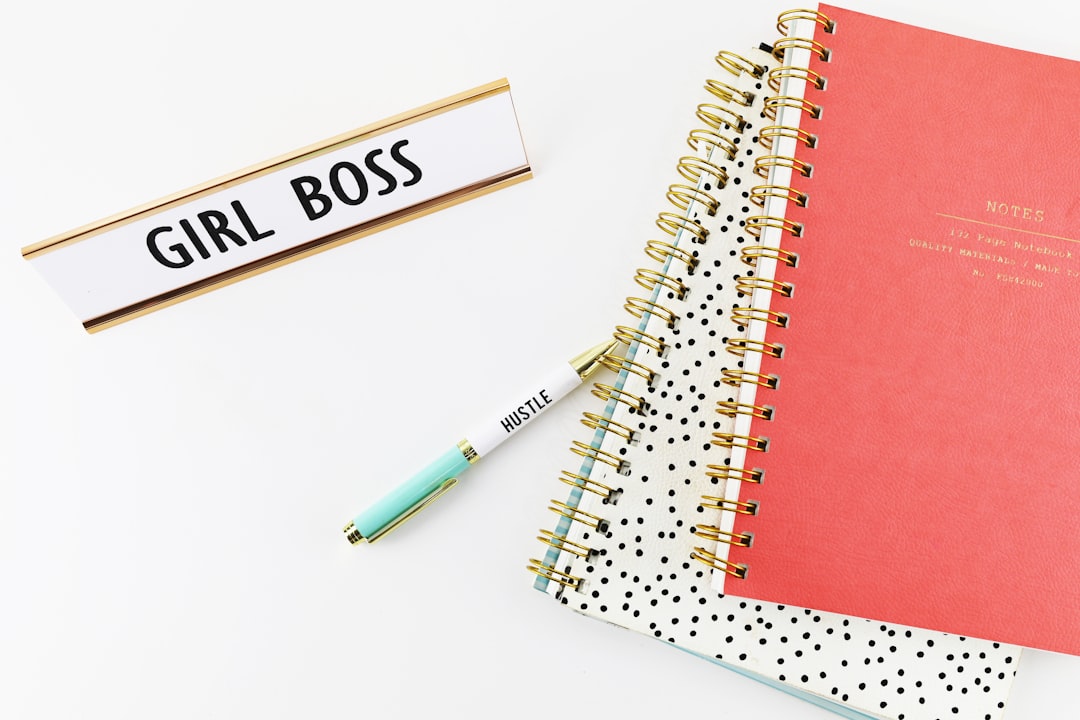 two spring notebooks beside ballpoint pen, everygirlboss.com
