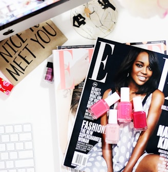 Aja Naomi King! magazine near silver iMac