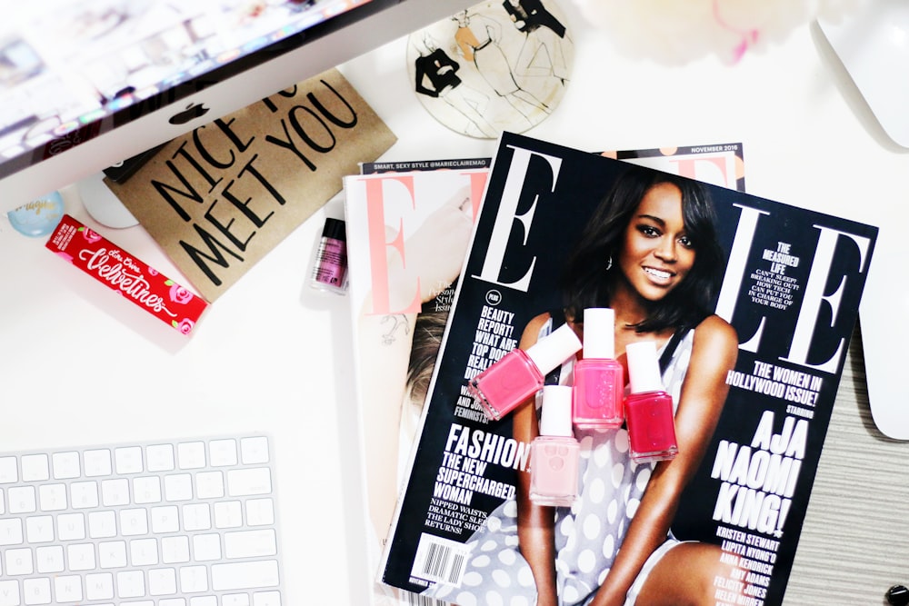 Aja Naomi King! magazine near silver iMac