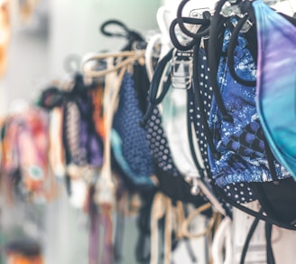 a row of bras hanging on a wall