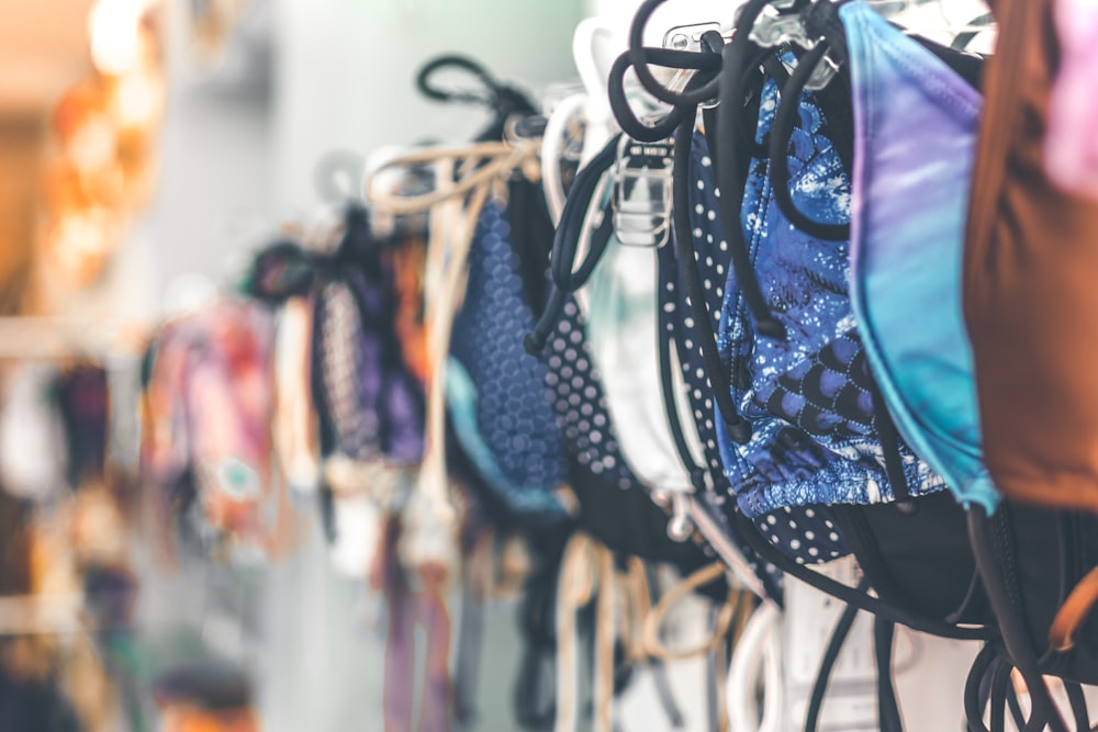 a row of bras hanging on a wall